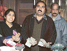 Ms Neelam and Mr Chander Sharma, sister and brother of victim Parveen Arora, show cash and jewellery found in the latter�s almirah, claiming that robbery could not have been the motive behind the triple murder.