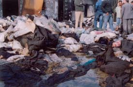 Piles of finished hosiery items, including cardigans and knitwears, that were damaged in a fire at a hosiery