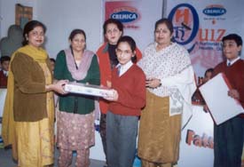 Winners receive prizes at a health awareness campaign organised by the Cremica Industries at S.A.N. Jain Model Senior Secondary School
