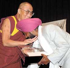 Dalai Lama gives away the Harmony Award in New Delhi on Wednesday to Master Ajit Singh, a philanthropist, who runs a school for orphans in Amritsar�s locality of widows. 