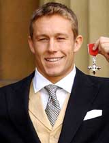England's 2003 Rugby World Cup hero Jonny Wilkinson shows his MBE award