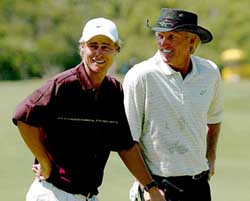 Australian tennis player Lleyton Hewitt chats with legendary Australian golfer Greg Norman 
