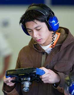 Williams's formula one driver Ho-Pin Tung from China holds a steering wheel at Jerez racing track in Spain on Wednesday