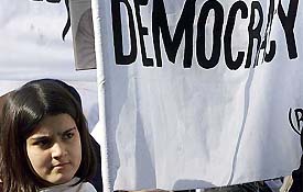 An Afghan refugee student holds a banner during a rally organised by the Revolutionary Association of the Women of Afghanistan outside the UN office in Islamabad 
