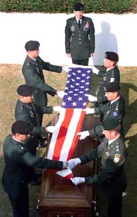 US Army officers cover the coffin of their fallen colleague Uday Singh with a US flag during a wreath laying ceremony in Chandigarh 