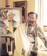 Prof Niren Sen Gupta and one of his paintings.