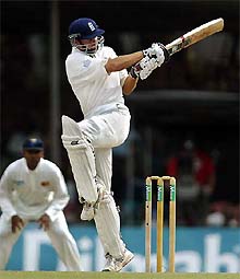 England captain Michael Vaughan pulls a delivery to the fence off the bowling of Sri Lanka's Chaminda Vaas 