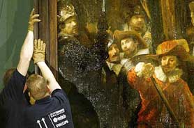 De Nachtwacht, one of the most famous paintings by Rembrandt van Rijn, is being removed from the wall at the Rijks Museum