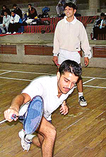 Gurjeet of DAV  College, Sector 10, returns a drop shot while his partner Akash Sethi looks on in the Pu Inter College Badminton Meet at the Gymnasium Hall on Monday.
