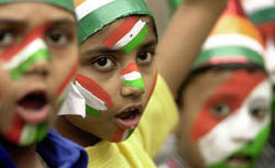 Young Indian cricket fans celebrate the Indian cricket team's win over world champions Australia