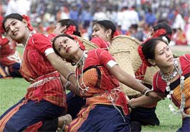 Bangladeshi tribeswomen dance at a Victory Day celebration in the Dhaka National Stadium