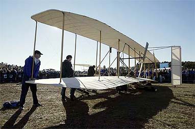 The Wright Experience Team rolls out the replica of the original Wright brothers plane