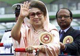 Bangladesh Prime Minister Begum Khaleda Zia waves to the crowd during the country's Victory Day celebrations