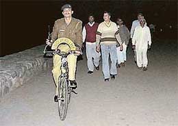 A policeman patrols on his bicycle