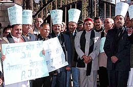 Himachal Pradesh BJP MLAs protest against their suspension in front of the state Vidhan Sabha on Wednesday.