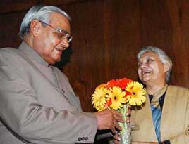 Prime Minister Atal Bihari Vajpayee receives bouquet from Sheila Dikshit at Parliament in New Delhi on Wednesday