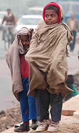 Kids brave the cold as mercury sharply fell down in New Delhi on Thursday