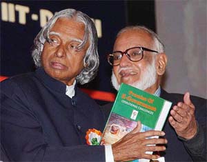 President A.P.J. Abdul Kalam receives the book, "Promise of e-Governance" from Professor M.G.K. Menon 