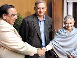 Delhi Chief Minister Sheila Dikshit greets Chowdhary Prem Singh, DPCC president after he was sworn in as the pro tem speaker by Lt-Governor Vijai Kapur on Thursday in the Capital.