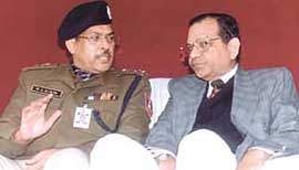 Delhi Police Commissioner R.S.Gupta with High Court Chief Justice B.C.Patel during a function on the UN International Day in support of migrant workers at Shivaji Stadium in the Capital on Thursday.