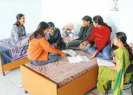Girls in a hostelroom, forever ready with a hearty laugh