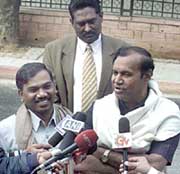 Union Ministers from the DMK, Mr T.R. Balu and Mr A. Raja, talk to the media outside Prime Minister Atal Bihari Vajpayee�s residence after submitting their resignation letters to him in New Delhi on Sunday