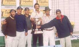 Winners of the All-India Club Golf Championship with the trophy at the Jaypee Greens Golf Club.
