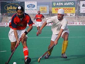 Players of Namdhan XI and Punjab Police trying to gain control of the ball in the 7th Farmtrac All-India Ramesh Chander Memorial Hockey Championship