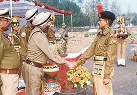 Mr K.J. Singh, Additional Director-General, CRPF, shakes hand with Cadet, General Duty, Mohammad Israel, recipient of the best drill award