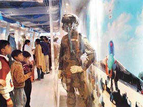 Children look at the gear designed by the DRDO for defence personnel, being shown in Vigyan Rail in Chandigarh