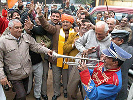 BJP members of J&K, including party president Nirmal Singh wearing a turban, celebrate the inclusion of Dogri language in the Eighth Schedule of the Constitution by the Centre