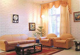 The cream-and-peaches drawing room uses light, air and space to the fullest