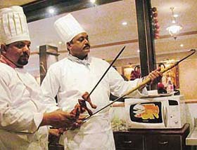 Cooks dish out a Lucknowi treat in the new �open kitchen� of Hotel Piccadily, Sector 22, Chandigarh