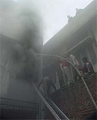 Clouds of smoke emanate from the Sanjay Apparel Corporation