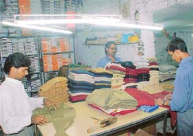 With an increase in demand, workers put in extra hours during the night to give finishing touches to hosiery products