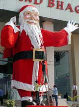 A 32-foot-high Santa Claus erected at a market place in Ahmedabad on the eve of Christmas