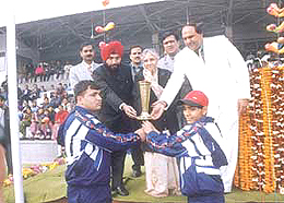 Delhi Chief Minister Sheila Dikshit passing on the torch of the 49th National School Games, helped by Delhi Education Minister Arvinder Singh and Deputy Director of Education Satpal, at the Chhatrasal Stadium on Wednesday.