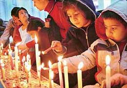 Children light candles at the Sector 19 church