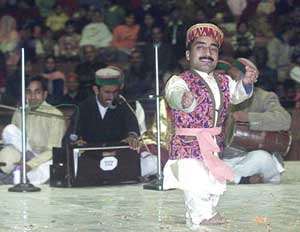 An artiste presents the traditional state dance during the Himachali Milan function in New Delhi