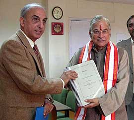 HRD Minister Murli Manohar Joshi receives the inquiry report on alleged irregularities by Dr A.K. Maitra