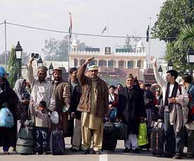 Ahmadiyya Muslims from Pakistan arrive at the Indo-Pak Wagah joint checkpost on Thursday.