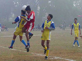Players of Chabbewal Academy, Hoshiarpur, and Rurkan Kalan, Jalandhar, try to take control of the ball in the first Punjab School Football Tournament at PAU, Ludhiana