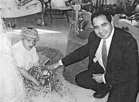 Canada-based NRI Ashwani Tangri with a student of Sheela Rani DAV Public School at the school fete in his native Bilga village of Jalandhar district