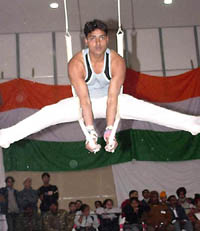 Vishal of Himachal Pradesh displays his skill in the Roman rings event in the 44th Senior National Gymnastics Championship which began at Mohali on Saturday.