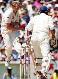 Australian pace bowler Brad Williams exults as he gets the wicket of Anil Kumble (back to the camera) on the second day of the third Test match at the MCG on Saturday. 