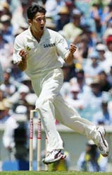 India�s Ajit Agarkar celebrates dismissing Australia�s Justin Langer for 14 runs during the second day of the third Test at the Melbourne Cricket Ground on Saturday.
