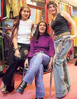 City dames display embroidered and hand painted jeans.