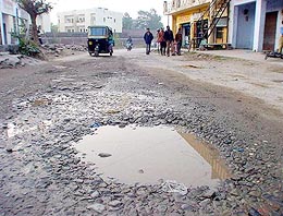 The broken roads affect the smooth flow of vehicular traffic in the Baddi industrial township