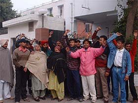 Relatives of the infant stage a dharna against hospital authorities outside DMC Hospital in Ludhiana