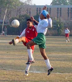 Players of A. S. Senior Secondary School, Khanna, and Government High School, Chabbewal, Hoshiarpur, in action during the final match